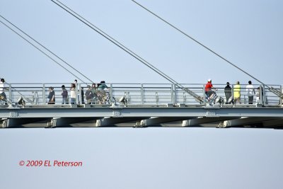 People on the Bob Kerry Pedestrian Bridge in Omaha, NE.