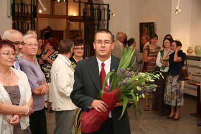 Here comes Lukasz with flowers for author of exhibition
