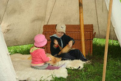 Little visitors inside mediewal tent