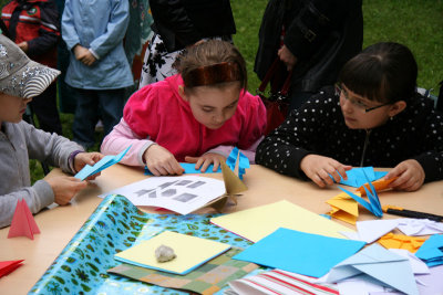 Children learn how to make origami