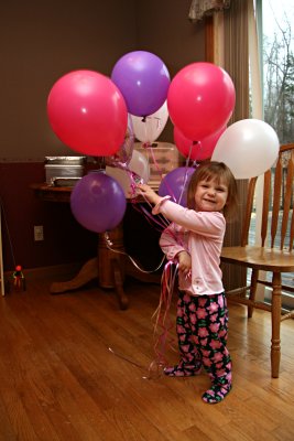 Girl loves her balloons!