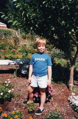 Skyler in the flower bed.jpg