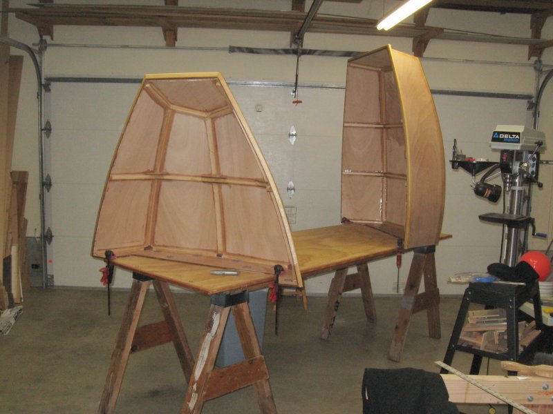 Separated and upright for fiberglassing the sheer rails.  A fun job.