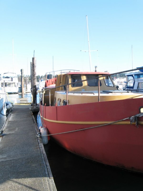 A once proud steel-hulled sailboat, now a garish poop-decked wonder.