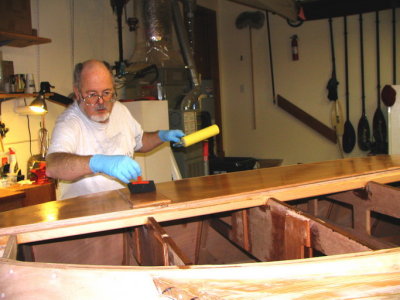 Inside of the plank saturated with epoxy; tipping off the bubbles with a dry foam brush.