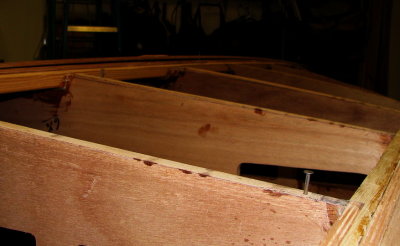 Cut off 8 penny nails hold the aft end of the plank off the frames.