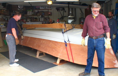 Time to roll the hull!  Castered cradle atop the hull, sitting on sawhorses.