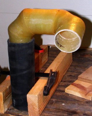 The second: twisted double 90 to port exhaust over to the thruhull. Glassed joint in the center