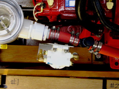 Test fit of fuel filter, sans hoses, atop the engine log.
