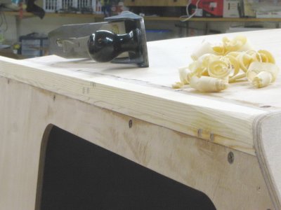 The sides get rounded forward of the eventual windshield location. I love making shavings.