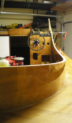 Cutting the coaming to the line; a satisfying curve! Framesto be glued in place; glass after paint.