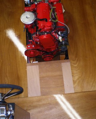Central panel: battery; smaller panels still bare wood. Battery box cover needs latches.