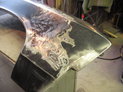 Working out the dents on the right front fender