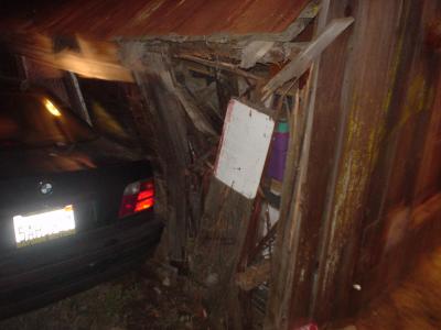 Another one of the barn and the car that hit it