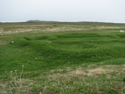 Hut outline under grass
