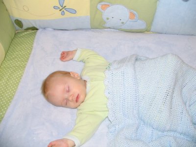 cozy in his crib