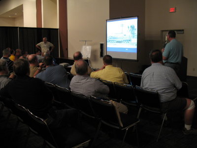 Mike Moore (right) and Clark Propst (back, center) Lecturing at the Tribute to Soph Marty Slideshow