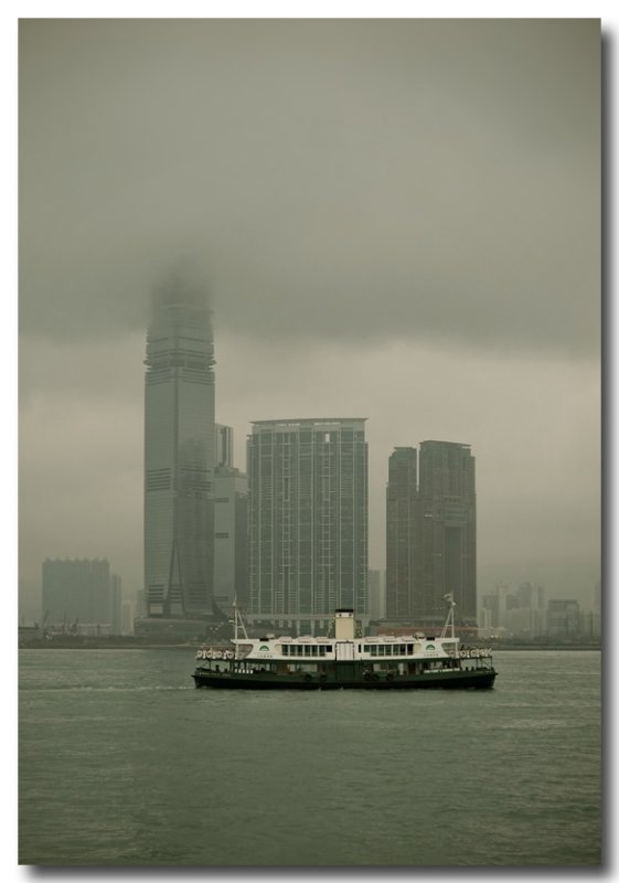 an old star ferry and some new skyscrapers