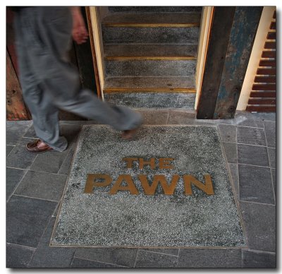 a passerby at the doorstep of the pawn