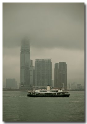 an old star ferry and some new skyscrapers