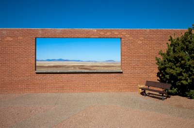 Brick wall with window looking north across the desert, west of Holbrook.