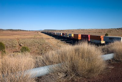 Eastbound container train passing under old US 66, east of Seligman.