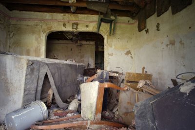 House, with plastic chair stuck in rafters, near the Industrial Canal breach.