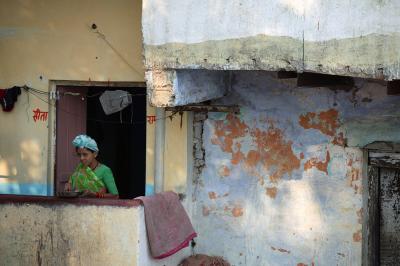 Woman on porch, Varanasi.
