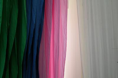 Newly-dyed fabrics on racks, Sanganer.