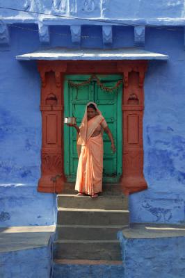 Woman emerging from house, Jodphur.
