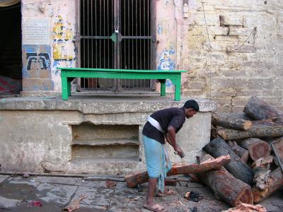 A dom chopping wood for the Manikarnika cremation ghats, Varanasi.