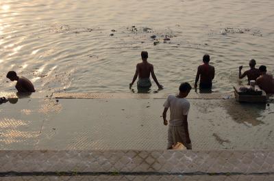 Men doing puja, bathing in the Ganges, Varanasi.