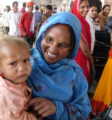 Mother with her child, train station, Jaipur.