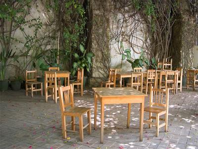 Empty tables and chairs at a cafe, Oaxaca.