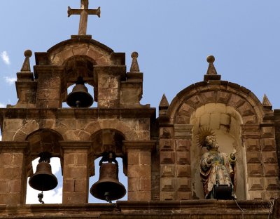 Bells, saint atop the cathedral.