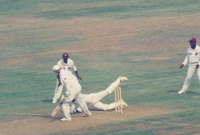 Wicket keeper attempts to take the catch!