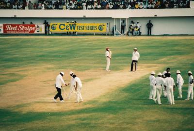 India celebrates taking a West Indies wicket