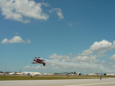 Pilot Fred Cabanas Opening the Fl. International  AirShow, Breaking Ribbon Up-side Down in Pitts Special