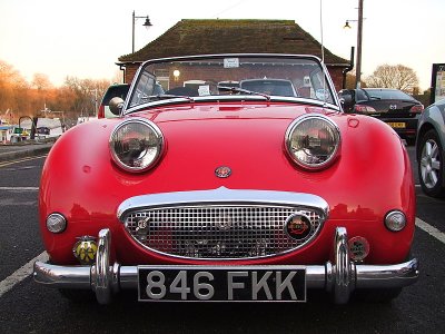 An Austin Healey Sprite,1960 version, in red.