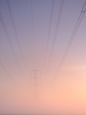 Electricity  pylon  through  the  morning  mist.