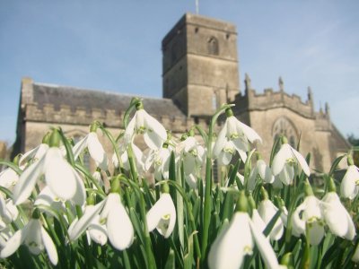 All  Saints  Church  fronted  by  seasonal  snowdrops.