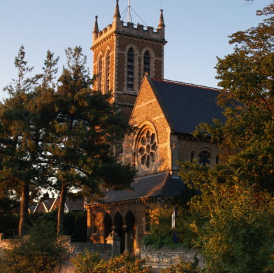 All Saints church lit by the setting sun