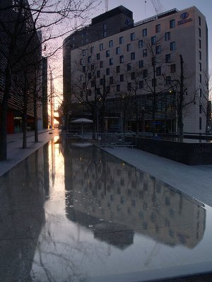 Hilton Hotel,SE1,reflected in unusual flat fountain.