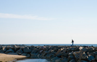 Fisherman on the Breakwater in Front of Convention Hall
