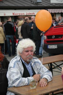 Sitting with a beer and a balloon