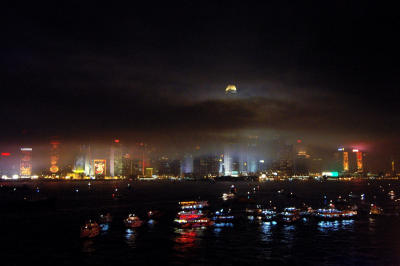 All the boats lined up to back to pier, heavy smoke is falling.