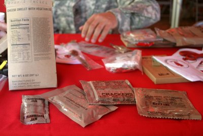 MREs are more than just food in a bag. The typical plastic MRE container has a main course, in my case an omelet, along with sides (crackers and strawberry jelly, an apple cinnamon pastry  basically a Pop Tart, cinnamon candies) and a smaller package with hand sanitizing wipes, water-resistant matches, gum, instant coffee, and more.