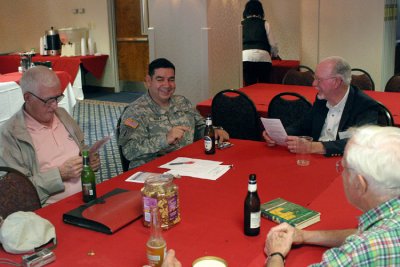 Master Sergeant Michael Mora spends a little down time with the veterans of OSS Detachment 101.