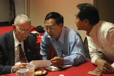 D. Ah Hpung (center) and Dr. Hkyet Aung are two Burmese men who joined the Association for this years reunion. For each reunion, 101 invites members of the Burmese population come to America to keep the story of their combined effort in World War II alive. Pete Lutken (left) spent time in Burma and China during the war and is currently involved in the Associations Project Old Soldier, a crop replacement program in todays Myanmar that teaches and finances farmers to grow food products instead of poppy to be harvested into opium.