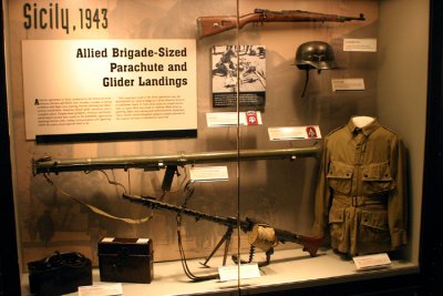 A display case in the Airborne and Special Operations Museum shows elements that were common to the European theater, including the American Army rocket launcher and the German MG34 machine gun.